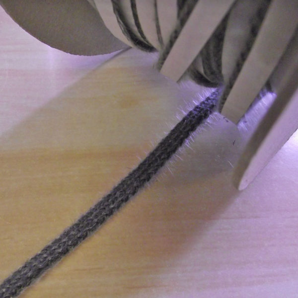 Thin self adhesive webbing tape.